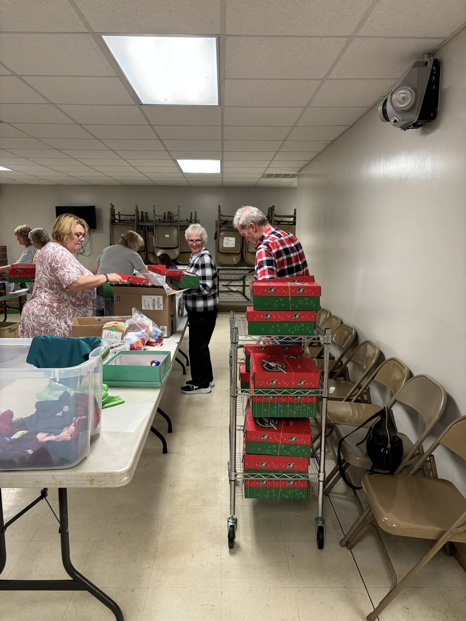 Church volunteers preparing Operation Christmas Child shoeboxes